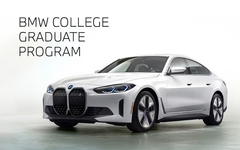 White BMW i4 parked. BMW College Graduate Program. | BMW of Peabody in Peabody MA